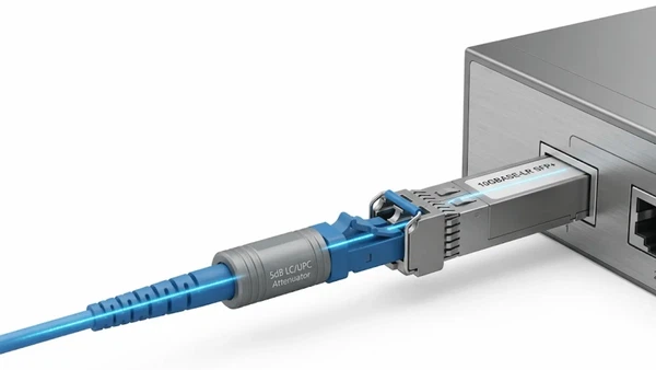 Fiber optic attenuator connected between an LC fiber patch cord and an optical transceiver. Fiber optic attenuator connected between an LC fiber patch cord and an optical transceiver.